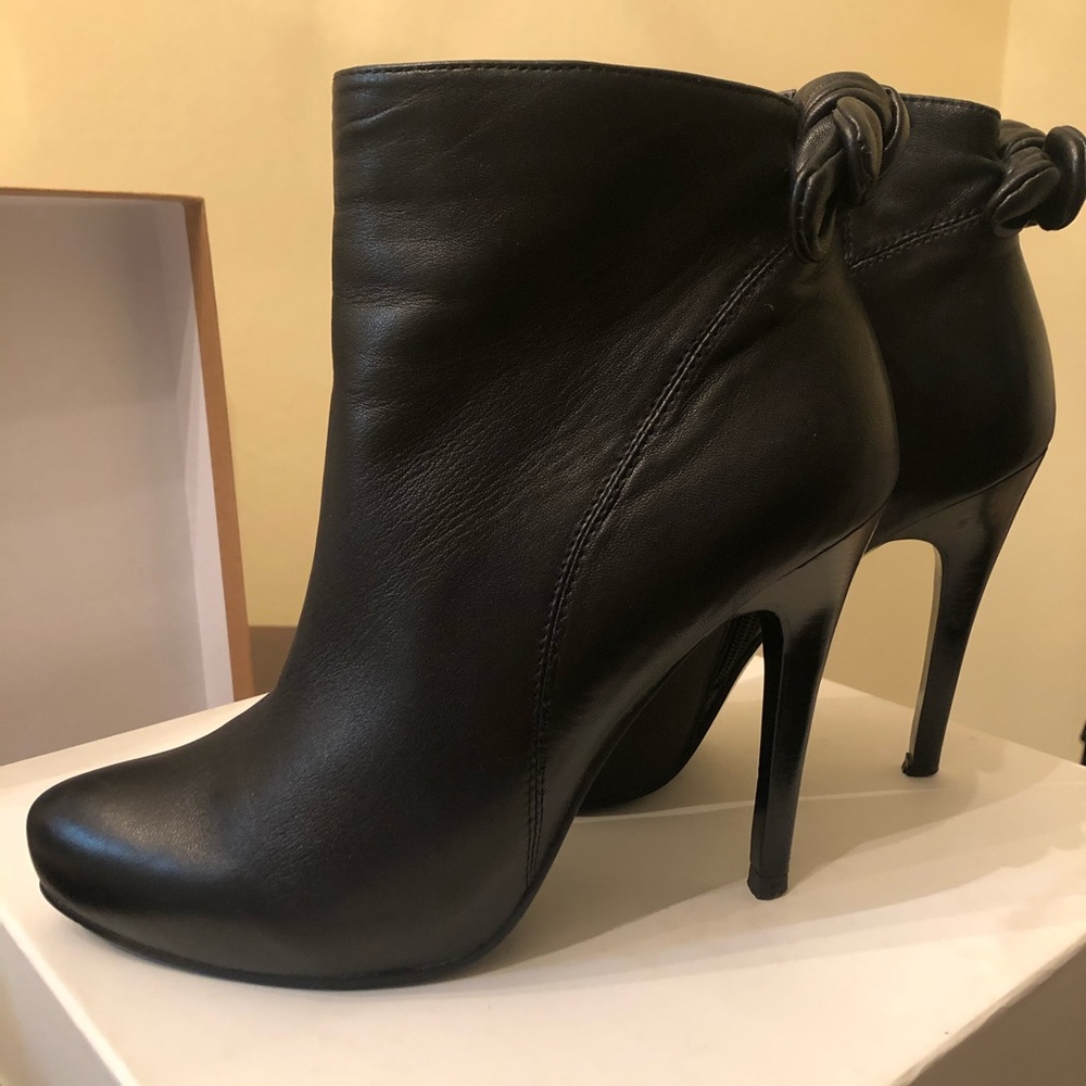 Women’s leather high heel boots with a double bow